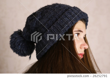 teenage girl in knitted blue hat with pompom teenage girl in knitted blue hat with pompom 26252791