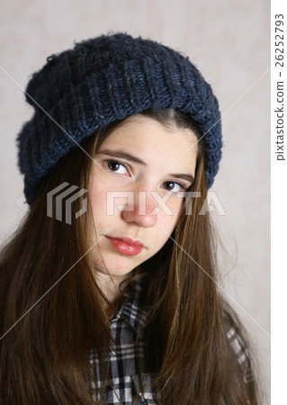 teenage girl in knitted blue hat with pompom teenage girl in knitted blue hat with pompom 26252793