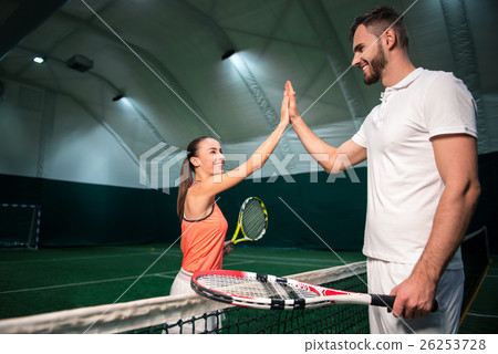 Joyful professional players going to play tennis 26253728