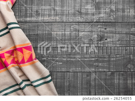 Warm soft wool scarf on wooden background texture 26254055