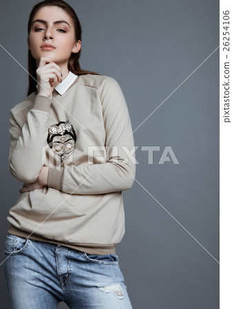 Beautiful fashion model wearing grey jumper scull Beautiful fashion model wearing grey jumper scull 26254106