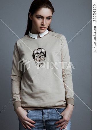Beautiful fashion model wearing grey jumper scull 26254109