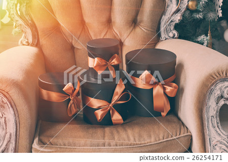 Wrapped gift black boxes with ribbons as Christmas Wrapped gift black boxes with ribbons as Christmas 26254171