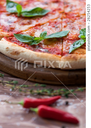 Italian pizza with basil leaves 26254253