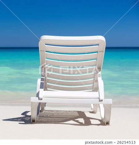 One sunbed on tropical beach with caribbean sea One sunbed on tropical beach with caribbean sea 26254513