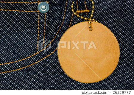 Leather label on blue jean denim with copy space. 26259777