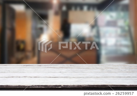 Wood table top on blur background of coffee shop 26259957