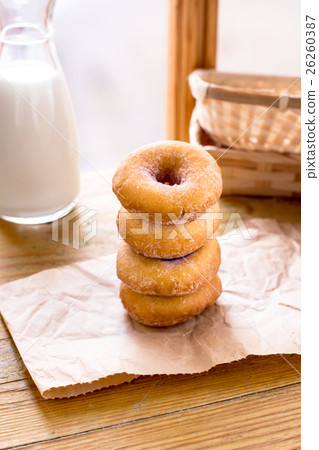 Stack of donuts on a piece of craft paper 26260387