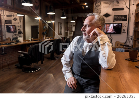 Senior businessman sitting at bar counter and 26263353