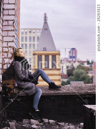 woman sitting on building rooftop. Suicide concept woman sitting on building rooftop. Suicide concept 26263815