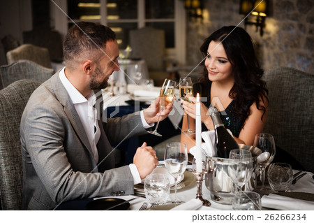 Couple celebrating in restaurant Couple celebrating in restaurant 26266234
