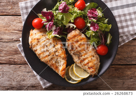 Grilled chicken breast with salad Grilled chicken breast with salad 26268673