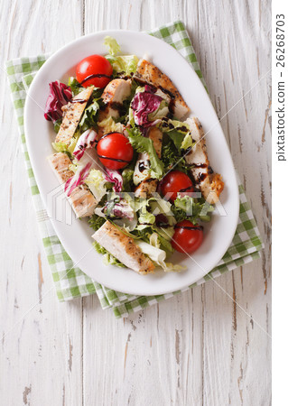 Tasty salad of grilled chicken, tomatoes and herbs Tasty salad of grilled chicken, tomatoes and herbs 26268703