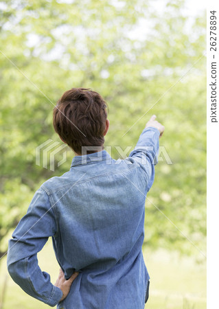 A man behind the pointing 26278894
