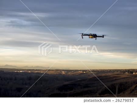 Small modern drone hovering taking picture 26279857