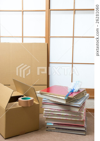 A stack of albums and a cardboard box 26281060