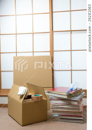 A stack of albums and a cardboard box 26281063