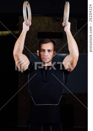 man using gymnastic rings 26284324