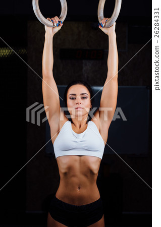 girl using gymnastic rings  26284331
