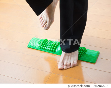 A man with a pain in stepping on a bamboo 26286898