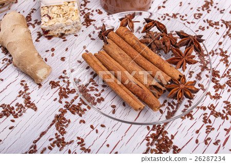 brown cinnamon sticks and grain clove lie brown cinnamon sticks and grain clove lie 26287234