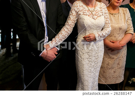 The guests stand on the wedding ceremony The guests stand on the wedding ceremony 26288147