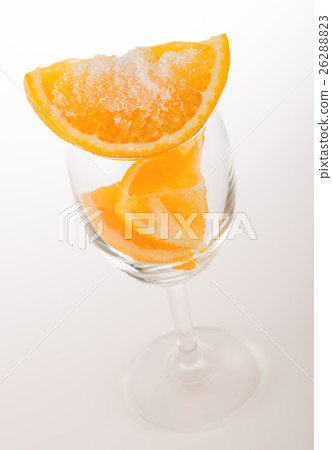 Fresh orange with salt in glass on white 26288823
