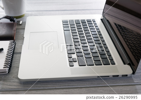 Computer glasses and telephone on the desk 26290995