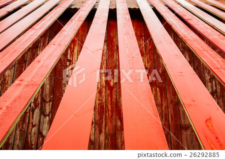 Red painted wooden planks are drying 26292885