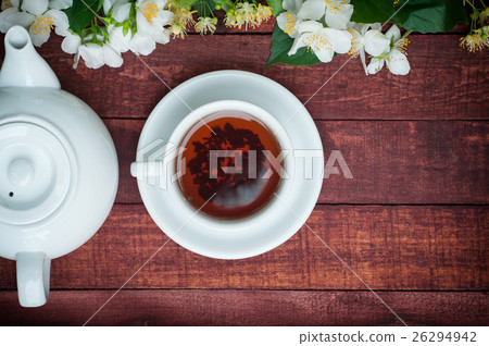 cup of black tea with,teapot and jasmine branches cup of black tea with,teapot and jasmine branches 26294942