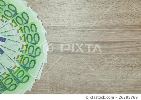 A lot of Euro money isolated on desk 26295769
