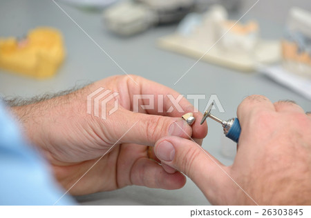 Dental technician working in  laboratory 26303845