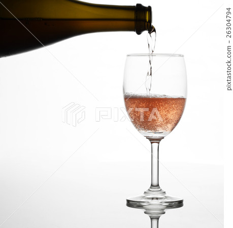 Pouring sparking rose wine on the wine glass Pouring sparking rose wine on the wine glass 26304794
