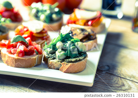 Bruschetta with beans and arugula, mushrooms Bruschetta with beans and arugula, mushrooms 26310131
