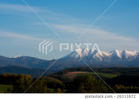Autumn earth and crowned snowy mountains 26311672