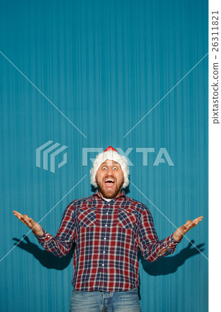 Surprised christmas man wearing a santa hat 26311821