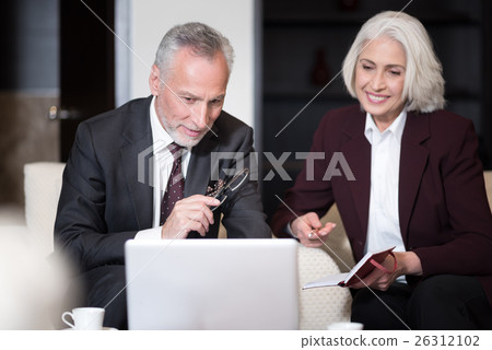 Involved businessman sharing points of view with 26312102