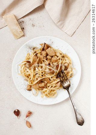 Cooked pasta with porcini on the white plate Cooked pasta with porcini on the white plate 26314617