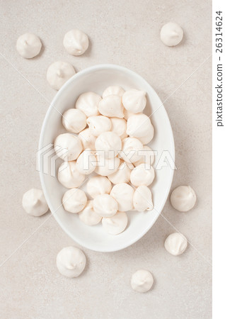 White meringues on the white plate 26314624