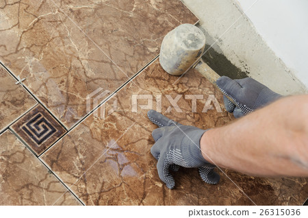 Laying the tiles 26315036