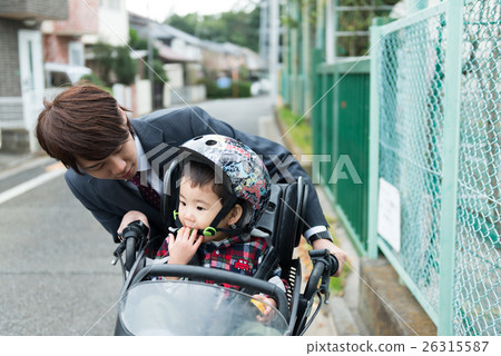 Attendance with daddy and toddler, children riding bicycle Attendance with daddy and toddler, children riding bicycle 26315587