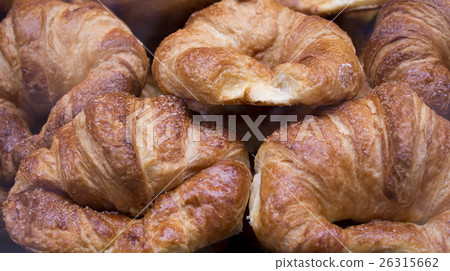 Several stacked croissant 26315662