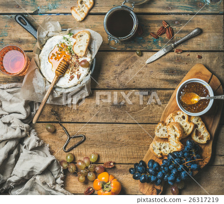 Cheese, fruit, nut and wine set over rustic wooden Cheese, fruit, nut and wine set over rustic wooden 26317219