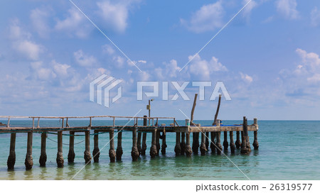 Pier leading to the ocean 26319577