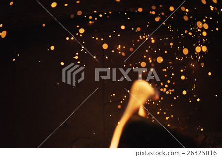 close up of charcoal burning in fireplace 26325016