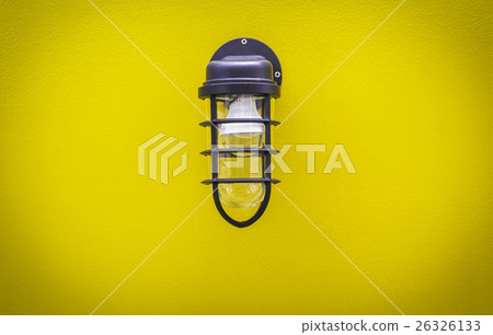 Classic lamp on surface yellow wall Classic lamp on surface yellow wall 26326133