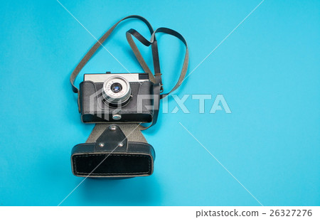 vintage film camera on blue background vintage film camera on blue background 26327276