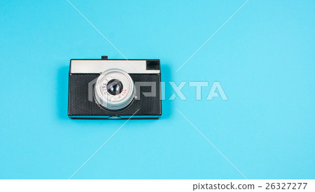 vintage film camera on blue background vintage film camera on blue background 26327277