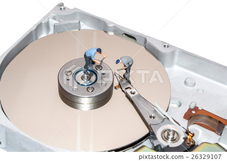 Miniature people repairing the hard drive. A broken computer equipment 26329107
