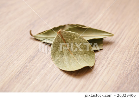 dried bay leaves on wood oak table dried bay leaves on wood oak table 26329400
